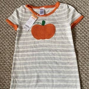 A cute Girls size 5 Gymboree pumpkin sweater dress